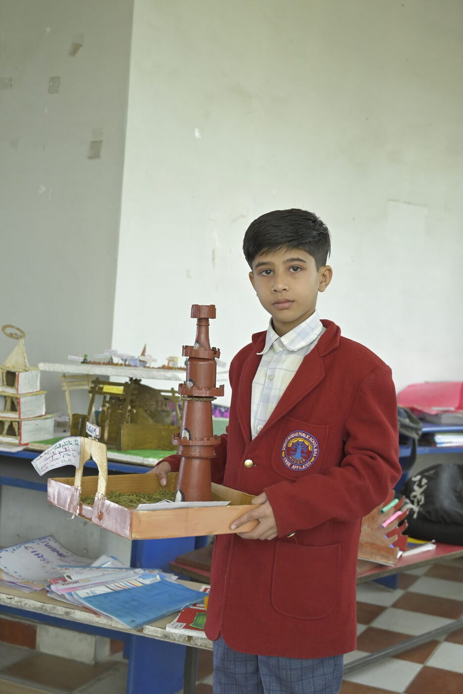 A student presents his working model in the activity room
