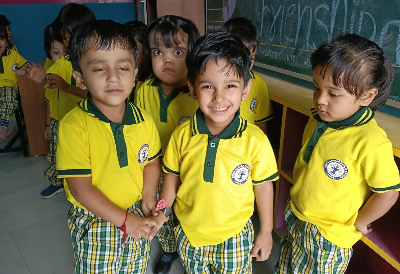 Kindergarten friends share a smile on Friendship Day