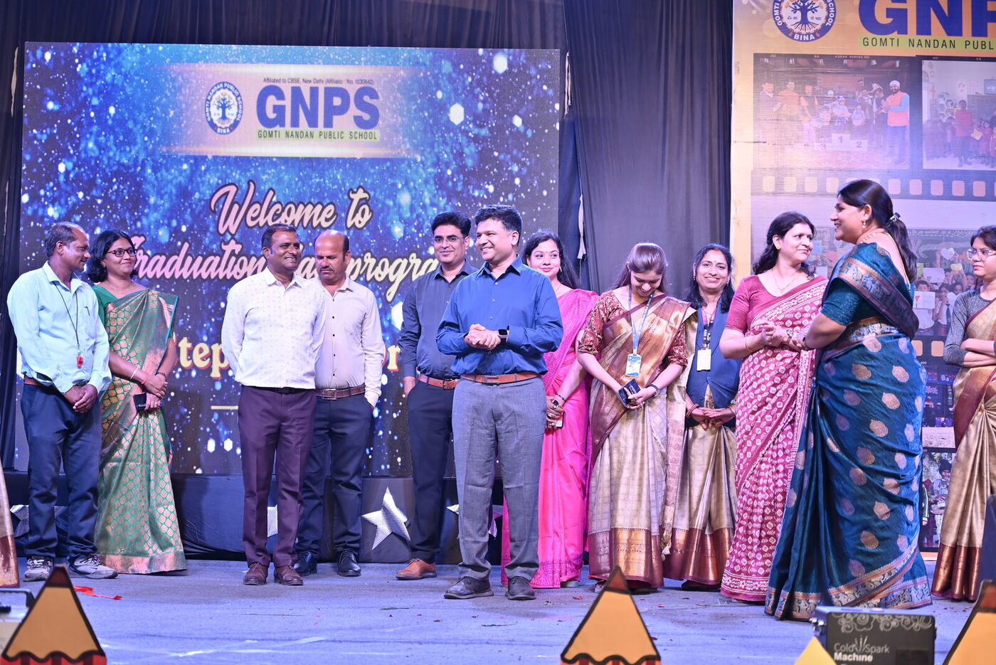 Guests and staff on stage at the Graduation Day 2026 ceremony