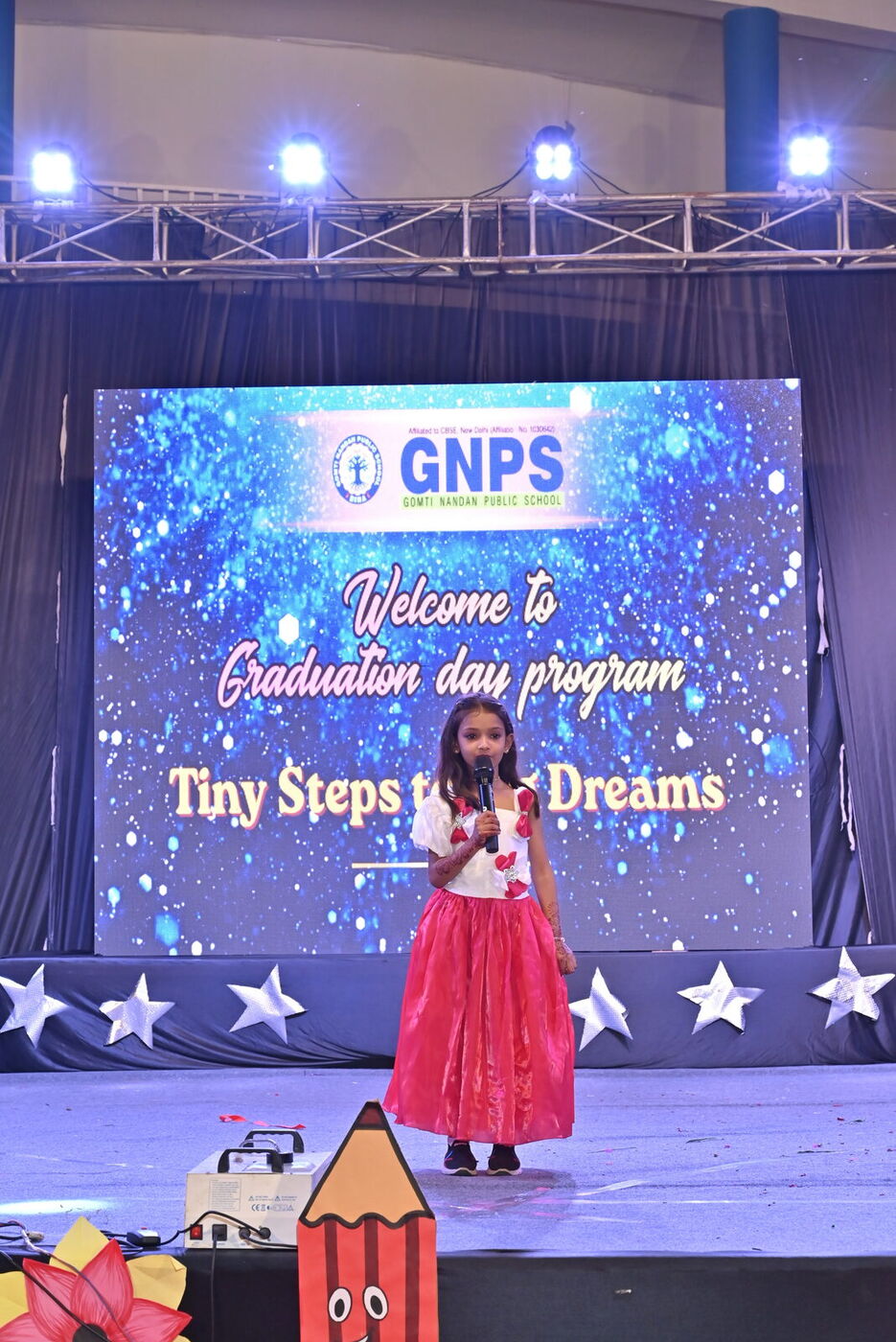 A young performer on stage at Graduation Day 2026