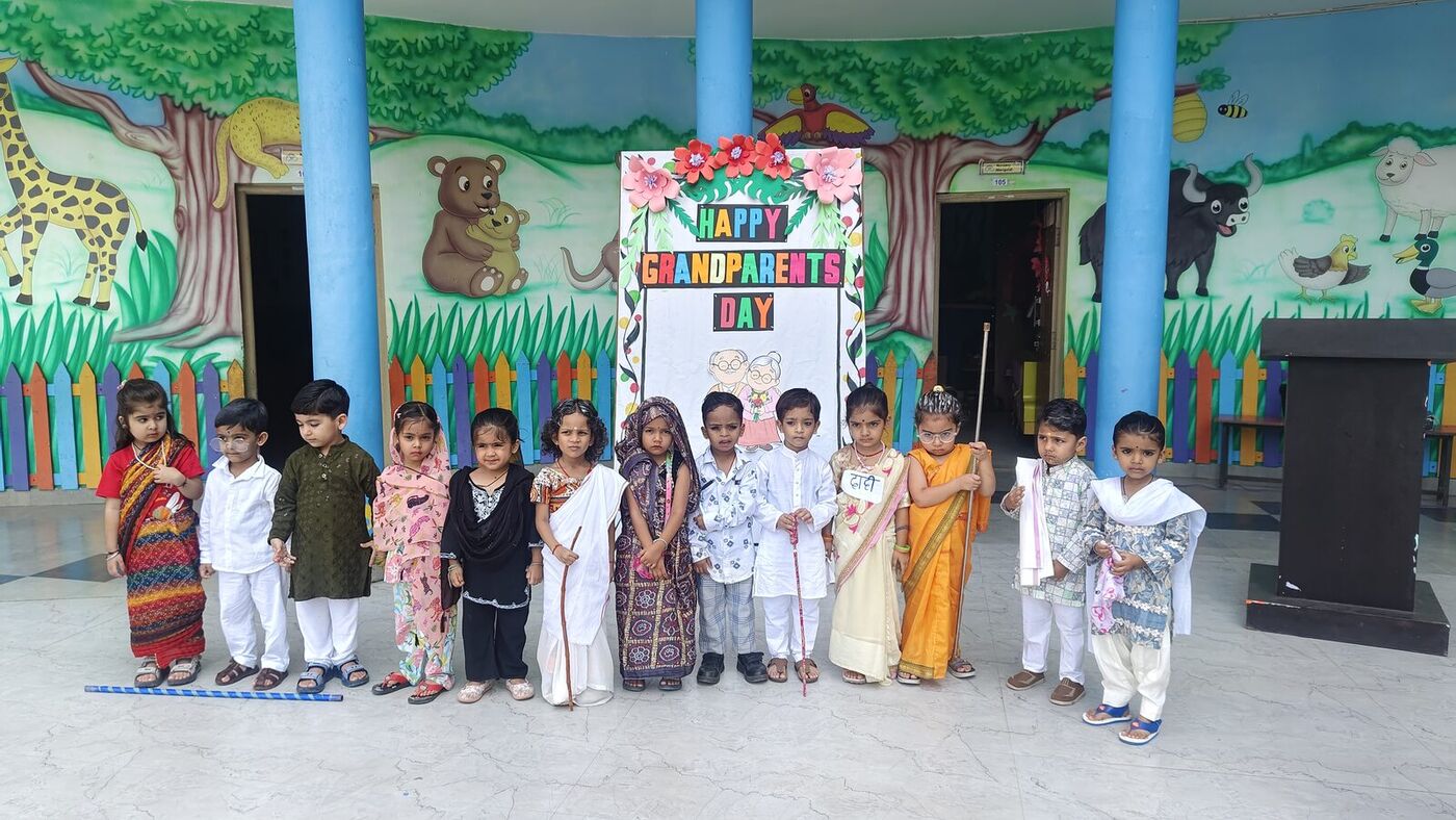 Kindergarten children dressed as grandparents celebrate Grandparents Day at GNPS