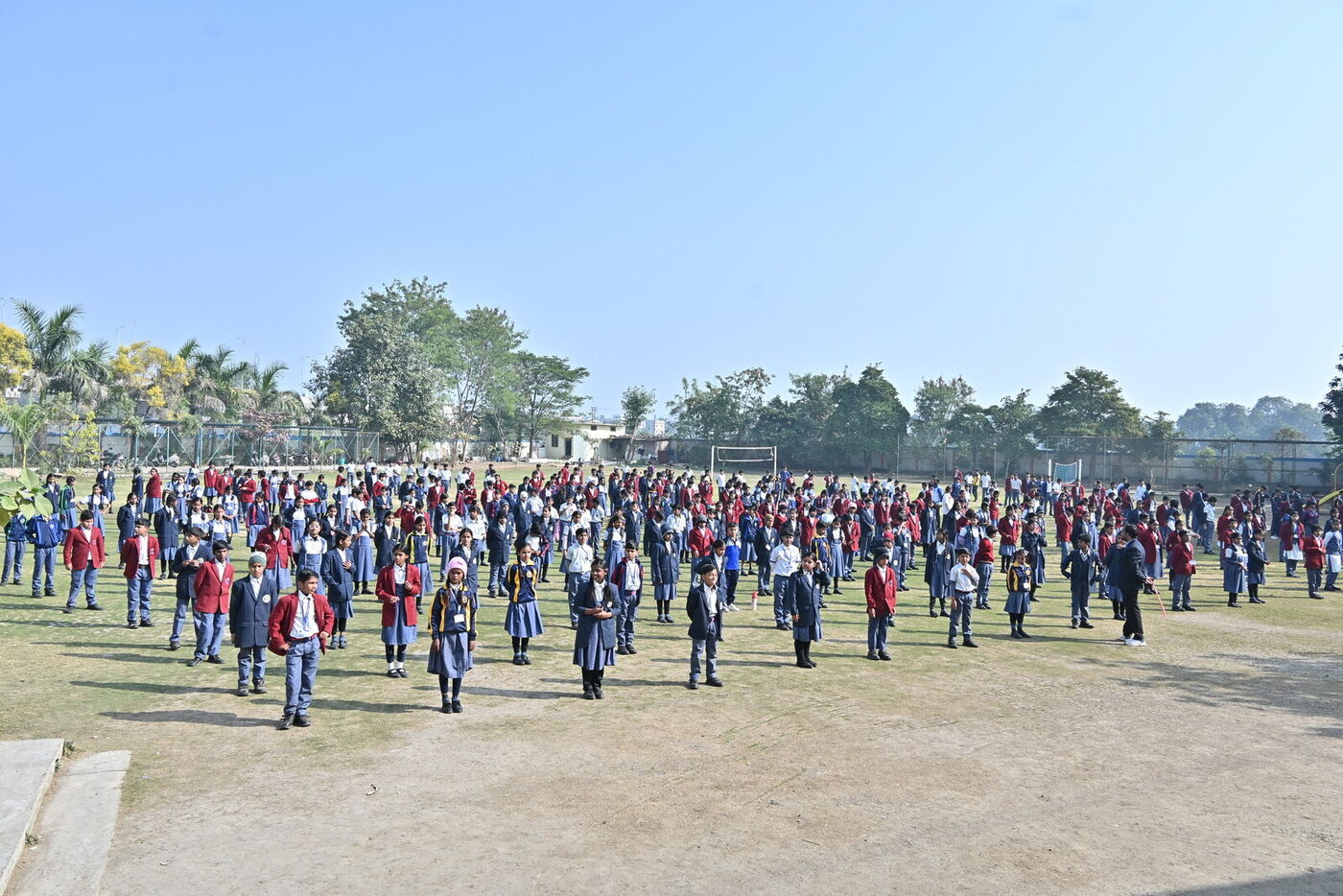 The whole school takes part in a mass yoga session on the sports ground for National Youth Day