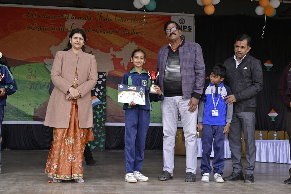 Students receive prizes from guests on Republic Day